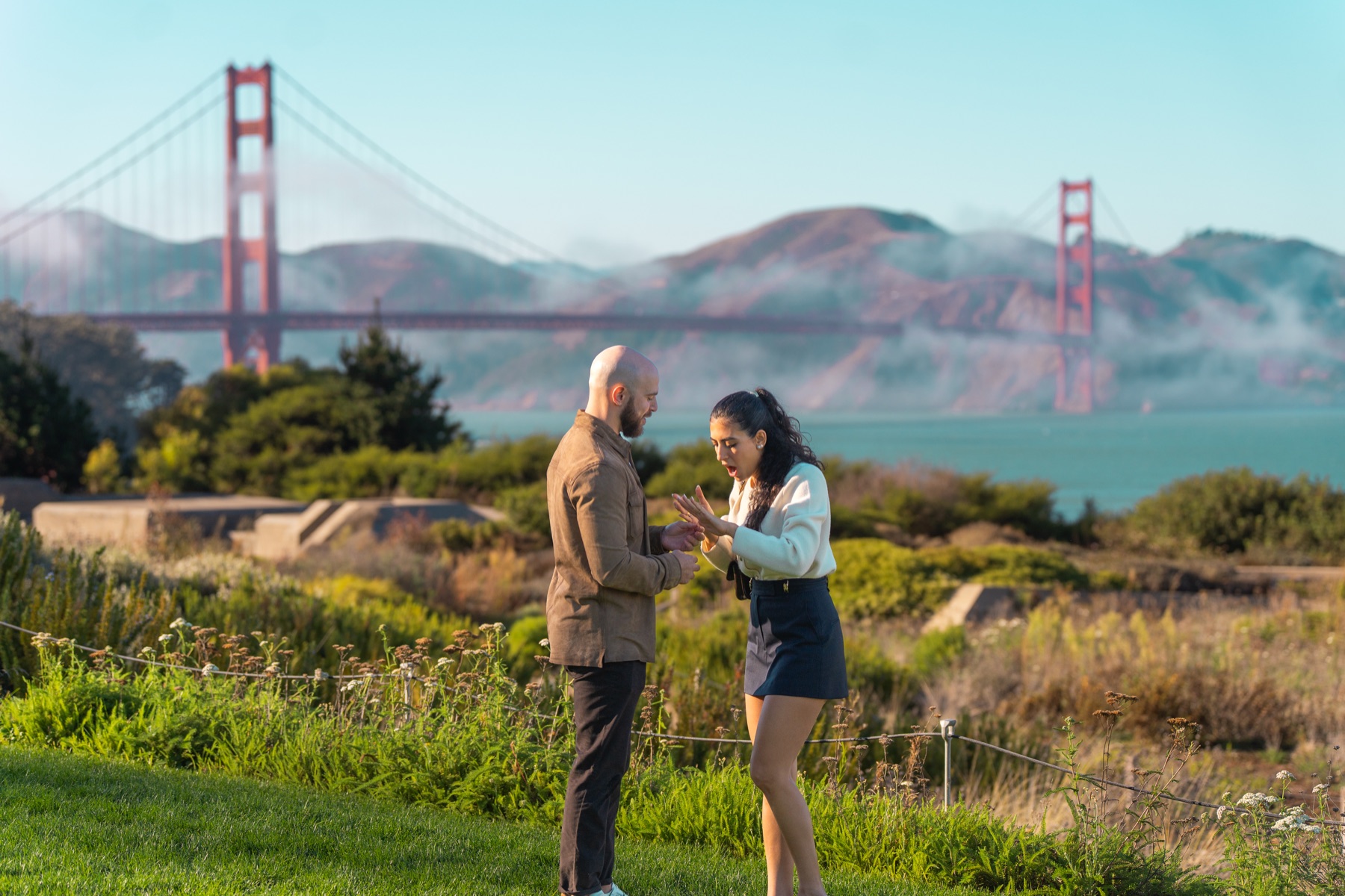 Alex and Abby taking in the moment after their Golden Gate Bridge proposal