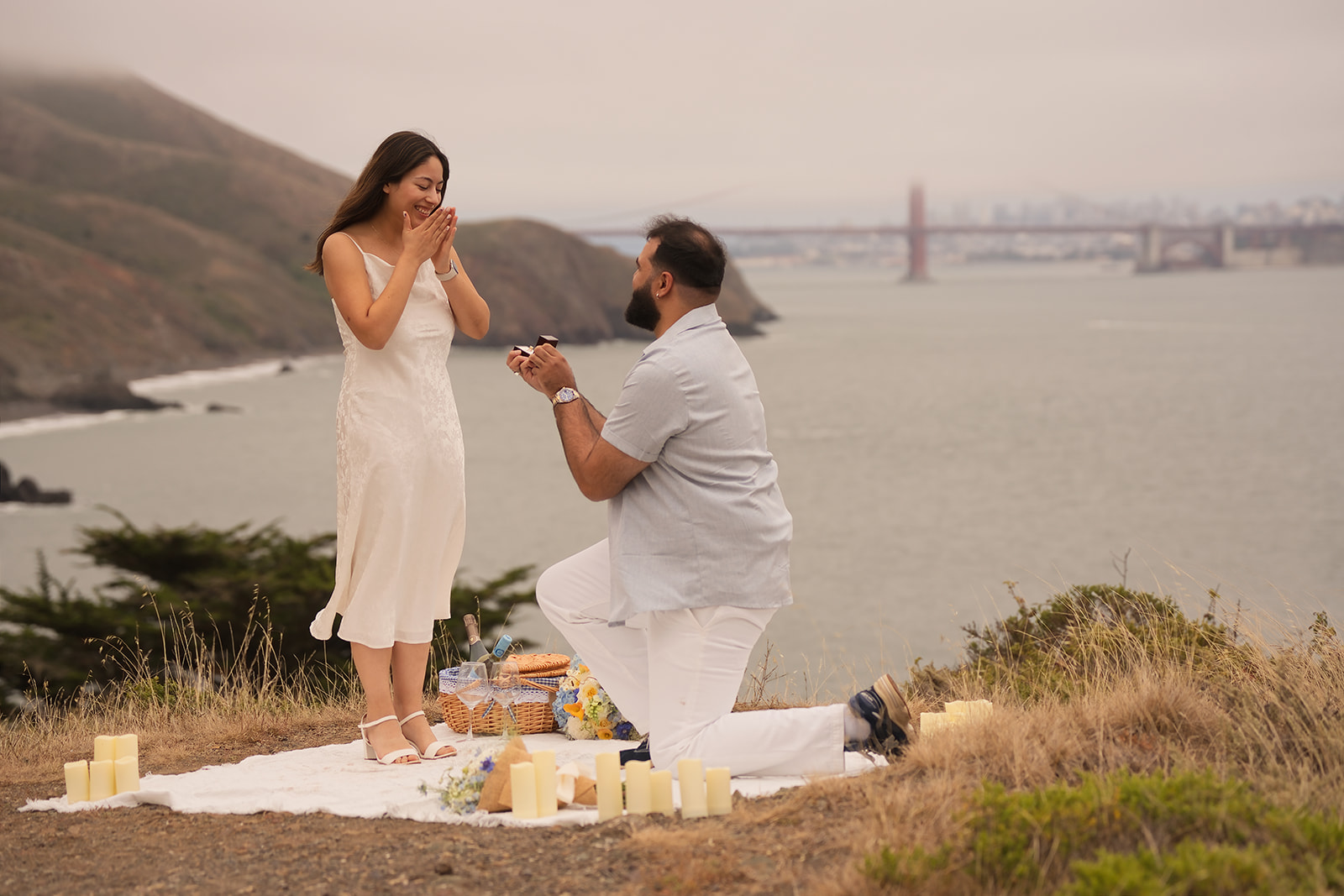 Surprise proposal with the Golden Gate Bridge in the background