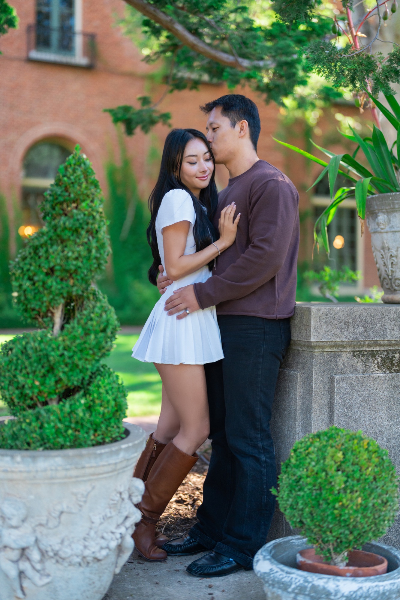 Ernest and Alexandra embracing in the formal gardens at Filoli
