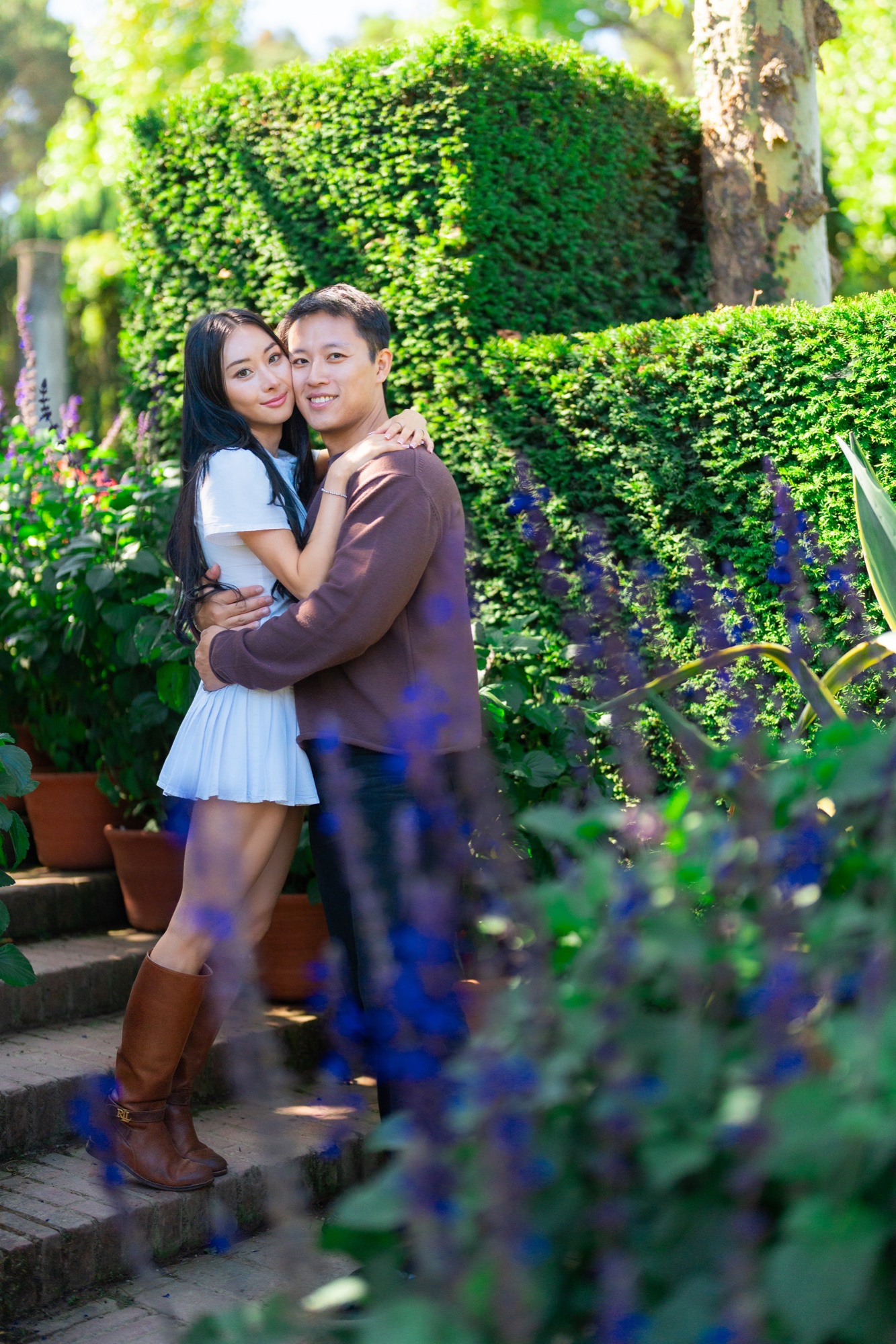 Ernest and Alexandra surrounded by flowers and sculpted hedges at Filoli