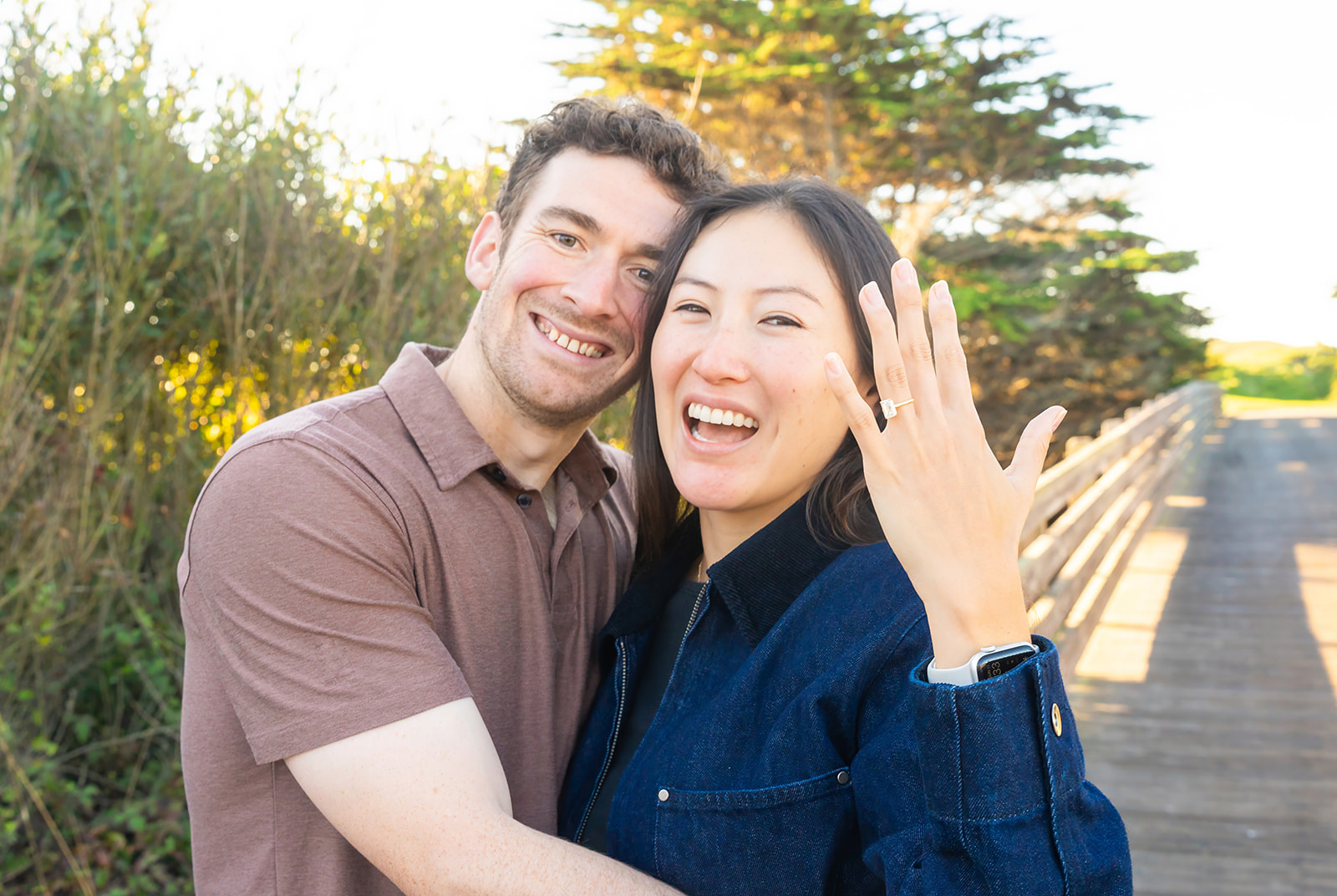 Harrison and Chase celebrating their engagement by the ocean