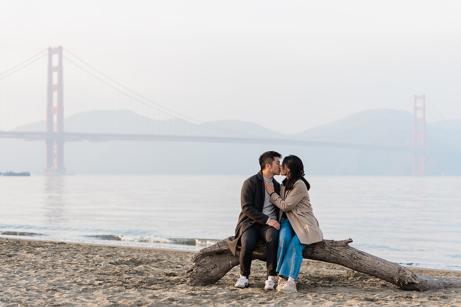A couple embracing after their Chrissy Field proposal